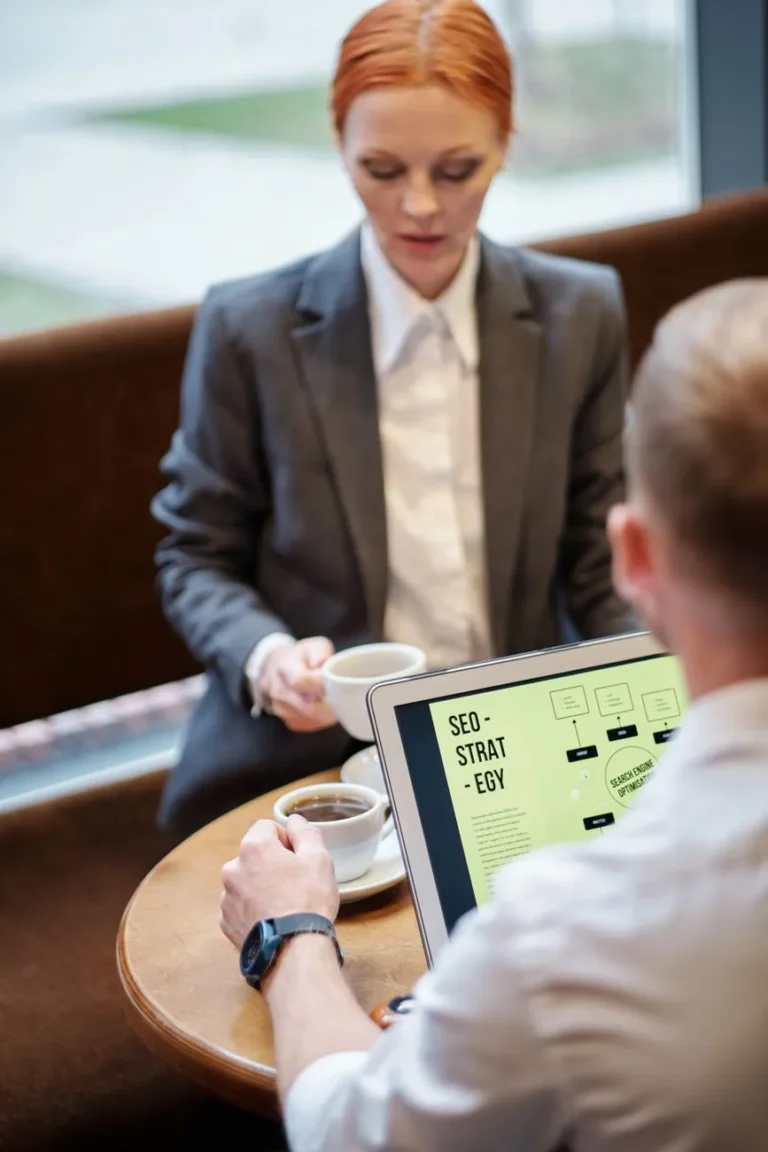 Consultant holding a tablet with an SEO strategy outline