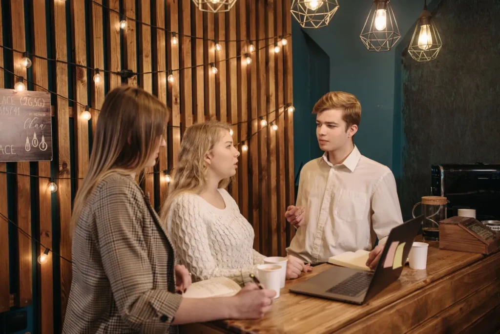 Team discussing a project in a warmly lit room