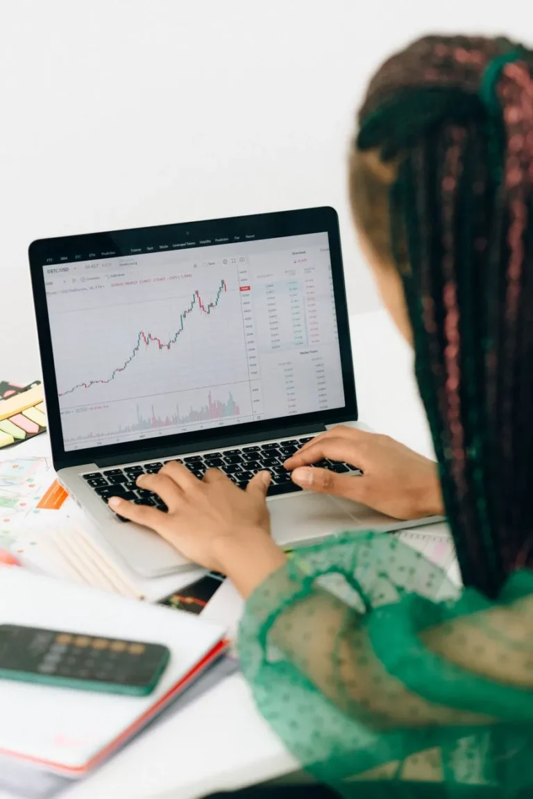 Analyst reviewing website conversion data on a laptop
